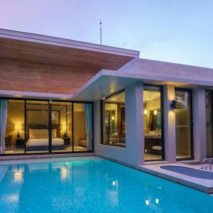 Modern house with a swimming pool, modern pool villa at the beach